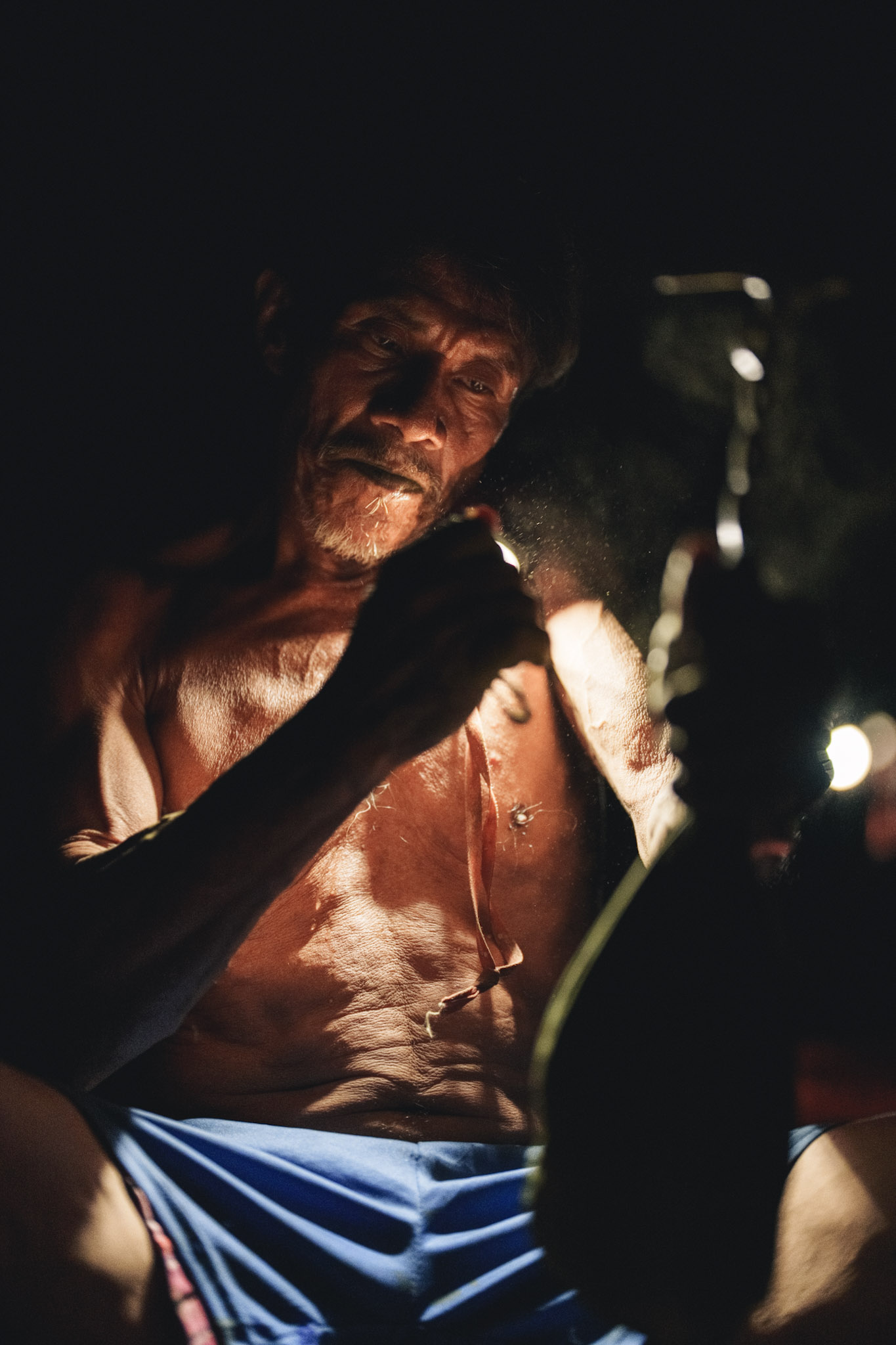 andoke elder preparing mambe in the colombian amazon