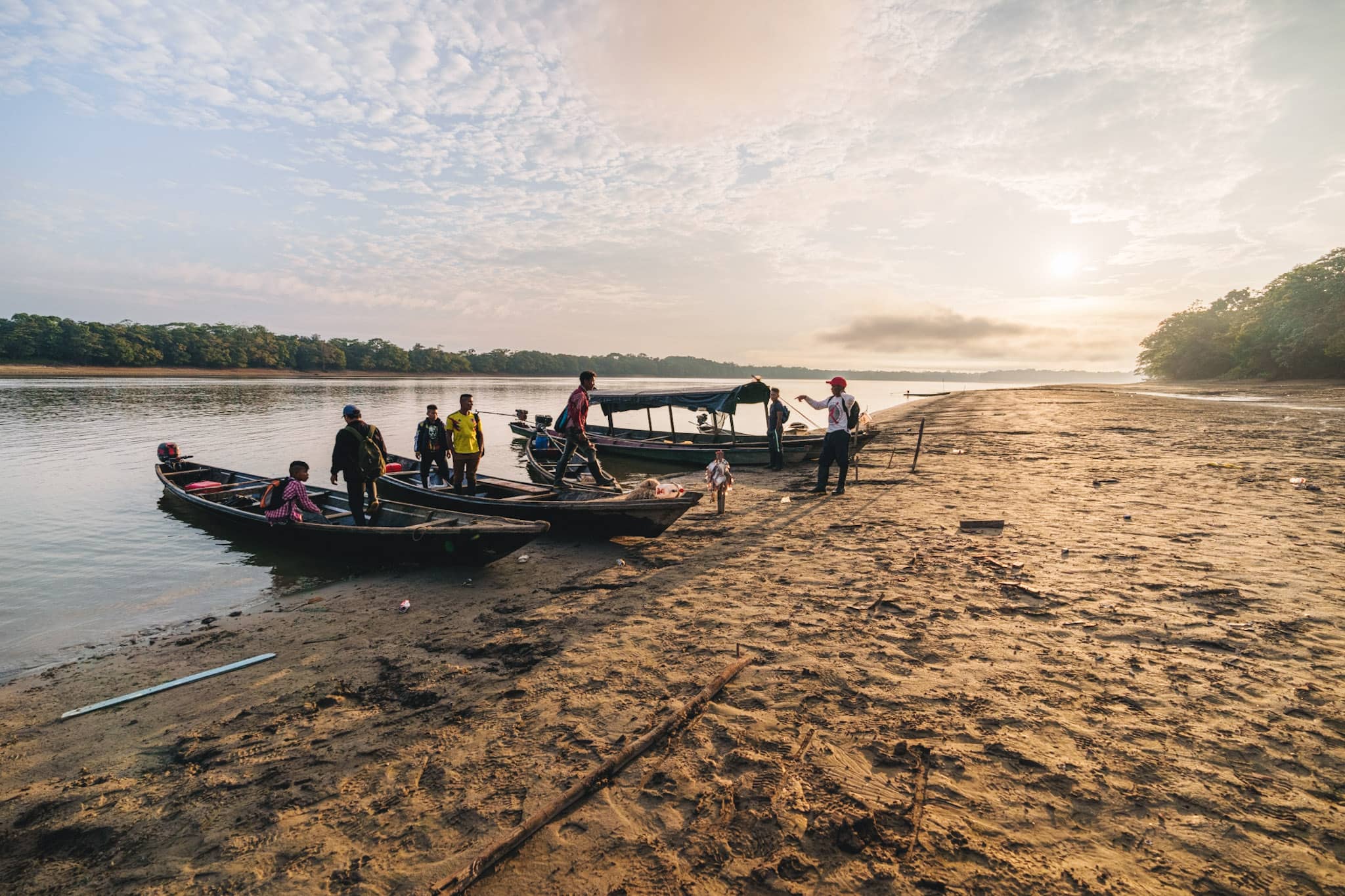 sunrise over a fisherman’s boat in araracuara in the colombian amazon