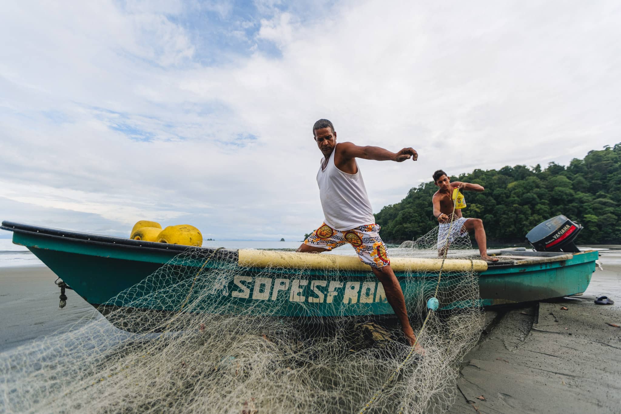 colombian fishermen in their boat with traditional gill net in the chocó